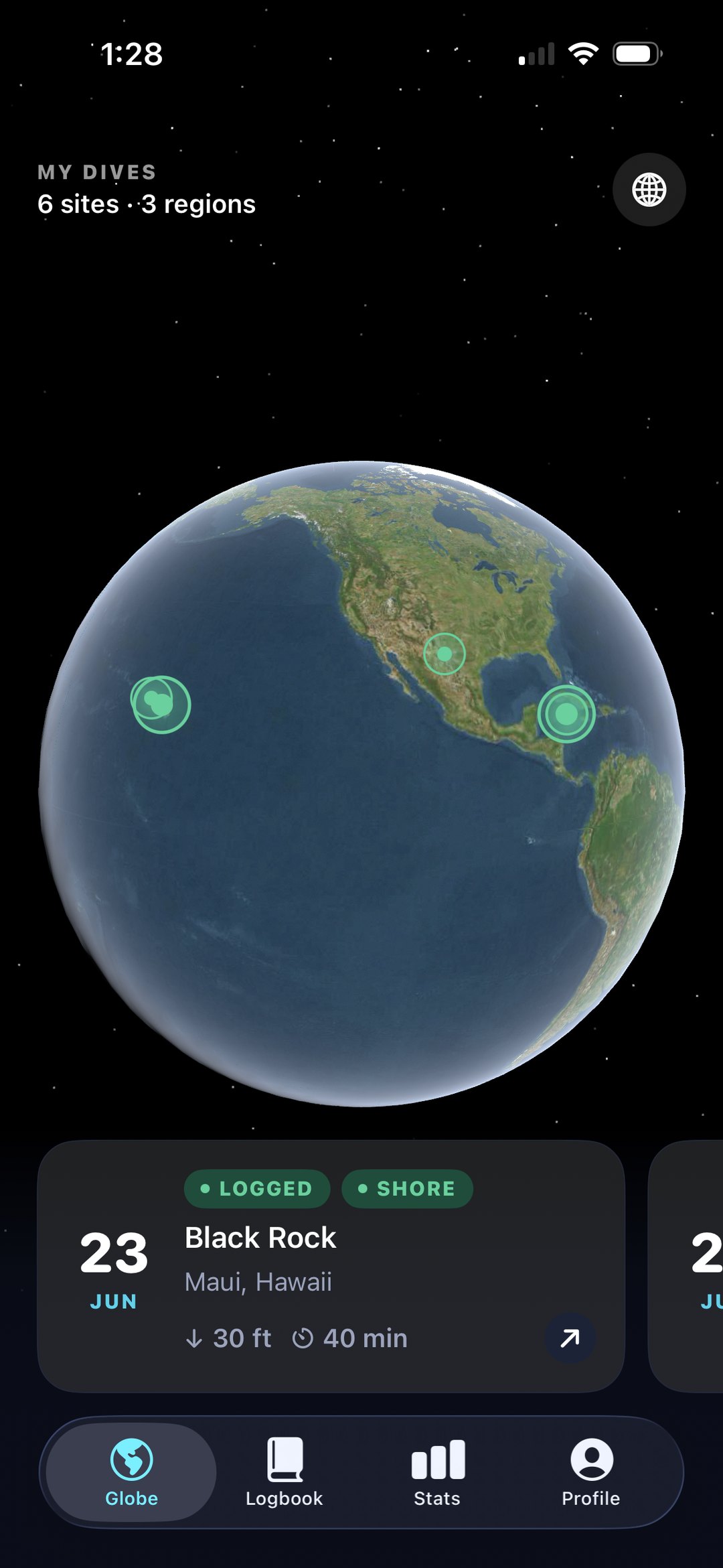 The Dyvo globe screen on an iPhone: logged dive sites glowing as pins across an interactive Earth, with a Black Rock, Maui dive card below